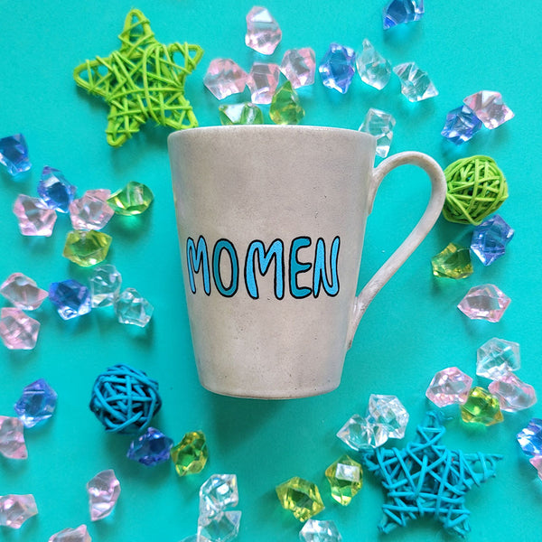 A Taupe hand painted mug with the name "Momen"