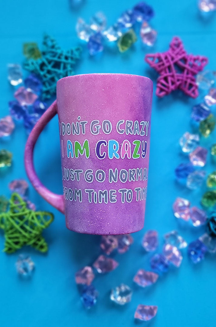 A Pink galaxy Hand Painted mug with the words "I Don't go Crazy, I Am Crazy, I just go normal from time to time"