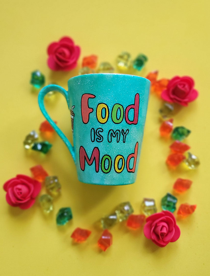 A green Galaxy hand painted mug with the words "food is my mood" and fast food items scattered all over