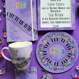 A Gift Set containing matching mug, notebook, frame,mdf plate, coaster and tree necklace all hand painted in lilac. The mug has thw words 