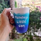 A Gradient hand painted mug with the colors (White turquoise and ultramarine) with the words 