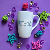 A baby blue hand painted mug with the name 