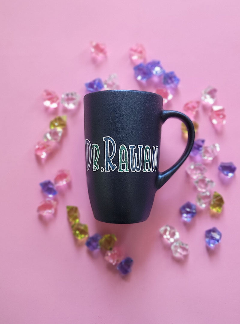 A Shimmery blue hand painted mug with the name "Dr. Rawan"