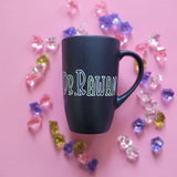 A Shimmery blue hand painted mug with the name 