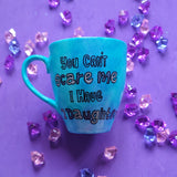 A Blue hand painted mug with the words 