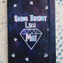 A Dark Sky hand painted notebook with the words shine bright like and a diamond drawn with the name "Mai" inside