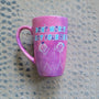 A hand painted pink galaxy mug with the words "don't worry, I got your back " and a drawing of 2 stick figures with the girl holding the back of the other girl