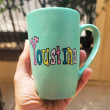 a min green hand painted mug with the name 