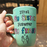 a mint green hand painted mug with the words 