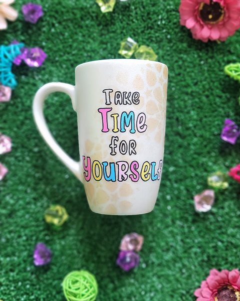 A Pearl white hand painted mug with gold geomteric patterns in the background and the words "Take time for Yourself"