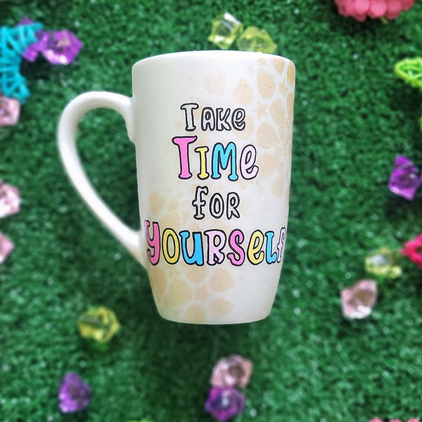 A Pearl white hand painted mug with gold geomteric patterns in the background and the words "Take time for Yourself"