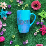 A Blue Hand painted mug with the name 