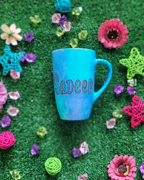 A Blue Hand painted mug with the name "sadeem "