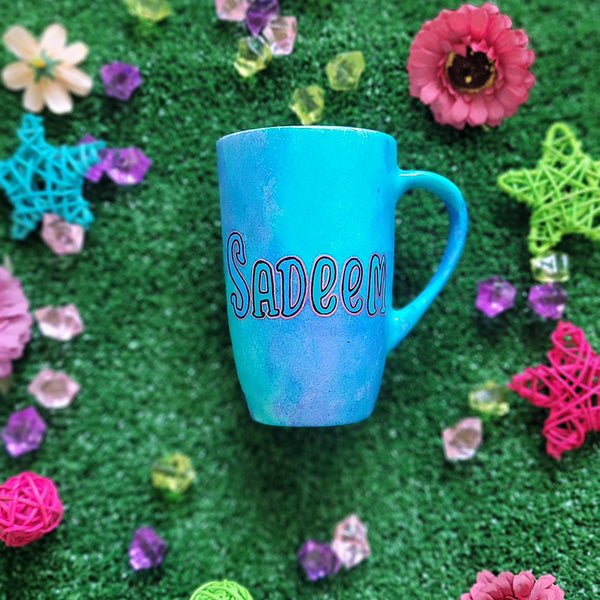 A Blue Hand painted mug with the name "sadeem "