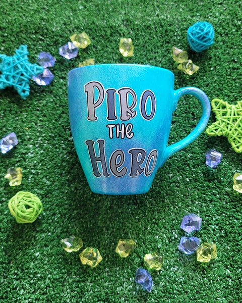 A Blue hand painted mug with the words "Piro he Hero"