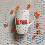 A Pearl White hand painted mug with the name 