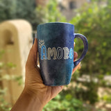 A black galaxy hand painted mug with the name 