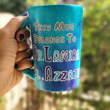 A Blue hand painted mug with the words :This mug belongs to Dr.Lamia el Azzazy