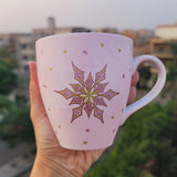 A Hand painted Baby Pink mug with a snowflake in gold