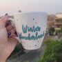 A Pearl White Hand painted mug with the words "Winter Wonderland" on turquoise