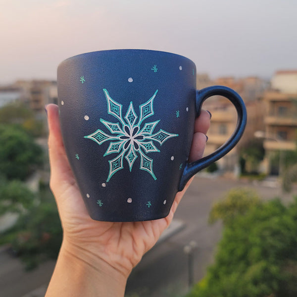 A Shimmery blue hand painted mug with the a Silver Snowflake