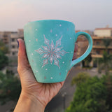 A Mint hand painted mug with A Snow flake