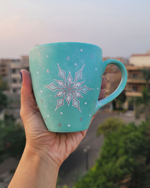 A Mint hand painted mug with A Snow flake