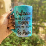 A Blue Galaxy hand painted mug with the words 