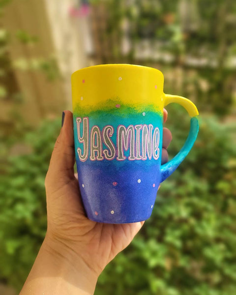 A Gradient colored hand painted mug with gradient colors of yellow turquoise and blue, with the name "Yasmine"