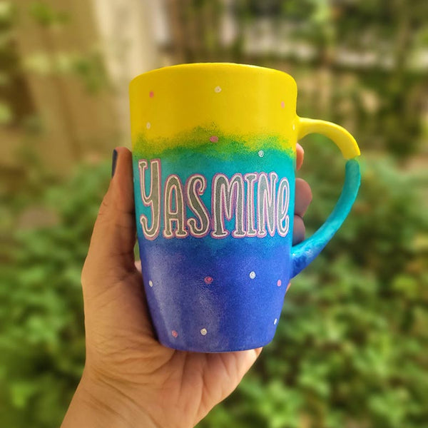 A Gradient colored hand painted mug with gradient colors of yellow turquoise and blue, with the name "Yasmine"