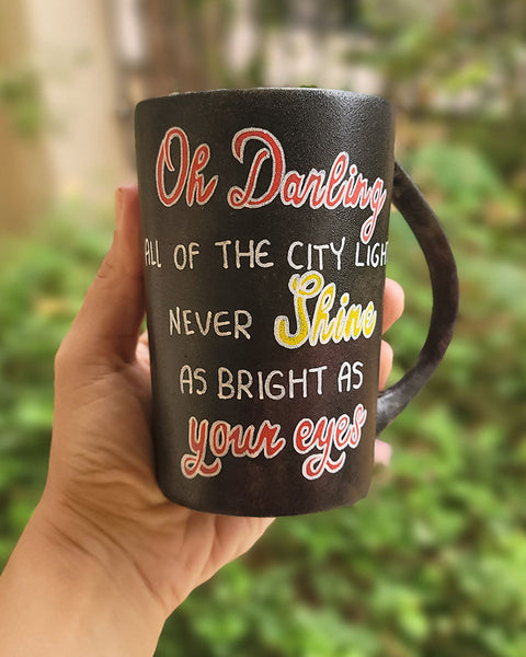 A Dark mug with the sentence