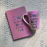 A Pastel Pink Hand painted gift set of mug and notebook with the name Dina wirtten on top and under it the sentence 