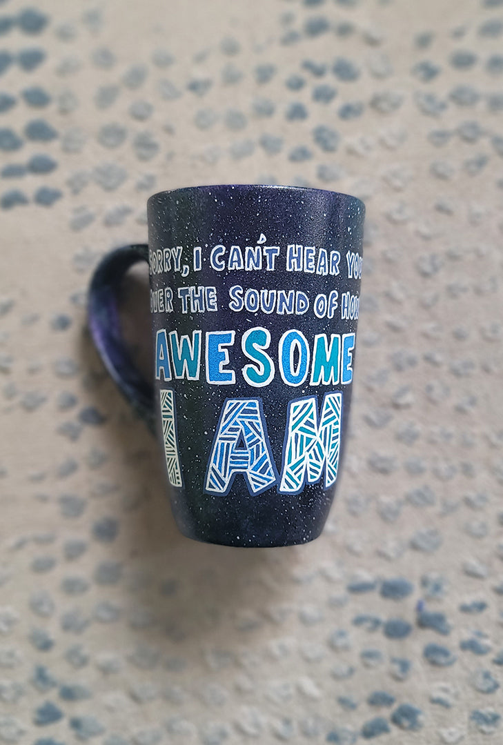 A Black Galaxy hand painted mug with the sentence "Sorry, I Cant hear you over the sound of how awesome I am"