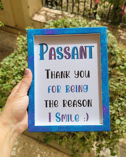 A Blue Galaxy Hand painted wooden frame with the following words written inside "Passant, Thank you for being the reason I smile:) "