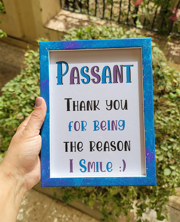 A Blue Galaxy Hand painted wooden frame with the following words written inside "Passant, Thank you for being the reason I smile:) "