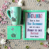 A Mint Green Hand painted gift set containing a mug with a a bunny design a matching coaster and a frame with the name 