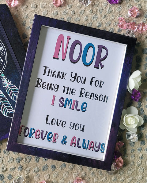 A Dark Sky hand painted wooden frame with the following written inside "Noor, Thank you for being the reason I smile. Love you, Forever and always"