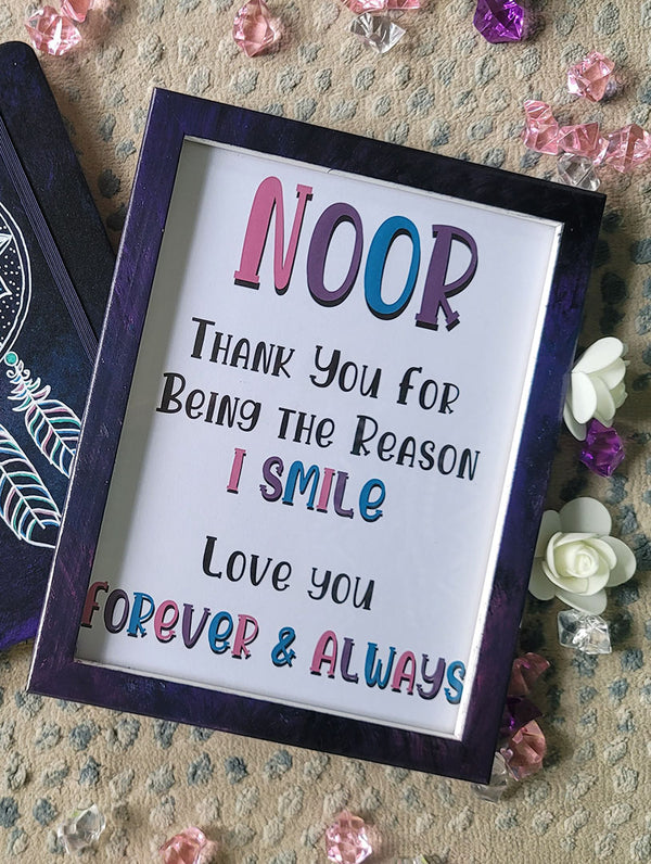 A Dark Sky hand painted wooden frame with the following written inside "Noor, Thank you for being the reason I smile. Love you, Forever and always"