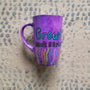 A Purple hand painted mug with the words "grow, Don't Shrink" and plants rising from the bottom of the mug to the third of height all around