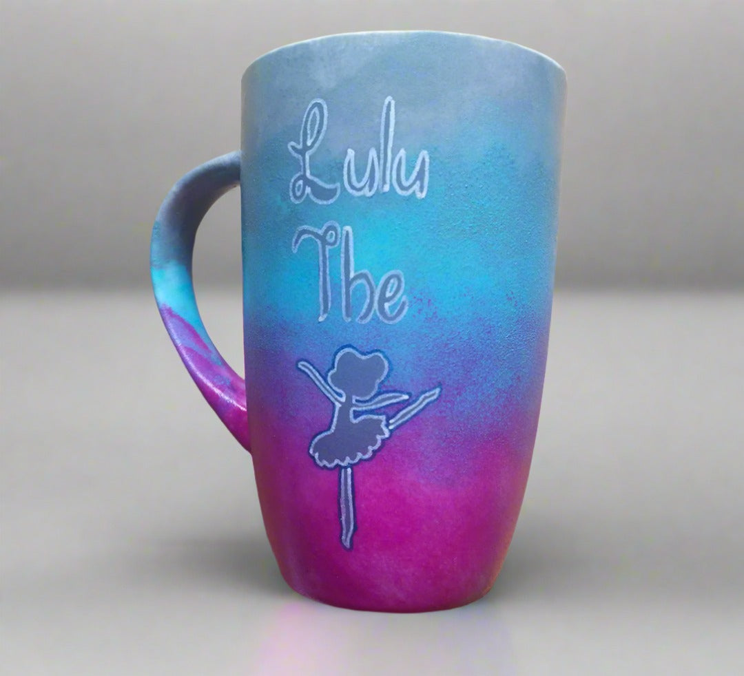 A Gradient hand painted mug (blue-grey-pink) with the words Lulu the and then a silhouette of a ballerina 