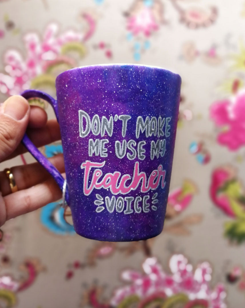 purple Galaxy hand painted mug with the words "Don't make me use my teacher voice"