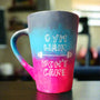 A gradient colored mug (from top grey then blue then pink) with the words "Gym hair, don't care" and a weight bar in between