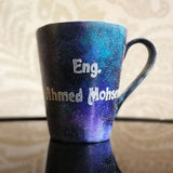 a bluish galaxy hand painted mug with the words 