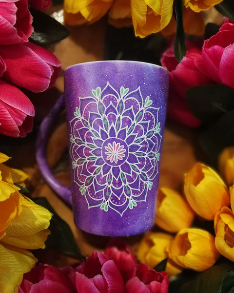 A Purple Galaxy Hand Painted Mug with a mandala