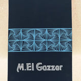 A Dark Blue Notebook with patterns drawn horizontally on half of the notebook  and the bottom half has the words 