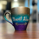 A gradient colored mug (Silver, turquoise and purple) with the name 