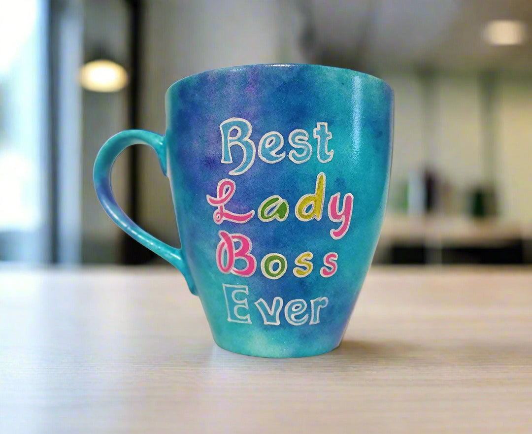 A Blue hand painted mug with the words "Best Lady Boss Ever"