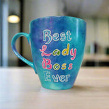 A Blue hand painted mug with the words 