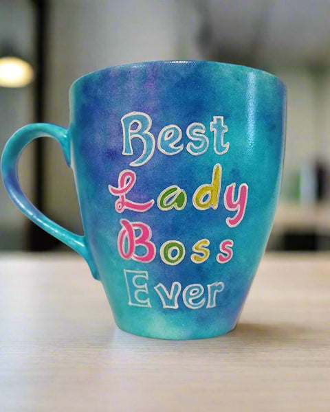 A Blue hand painted mug with the words "Best Lady Boss Ever"