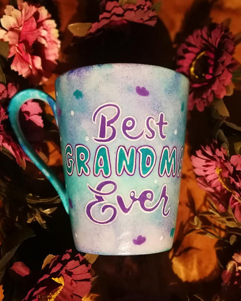 A pale blue purple  hand painted mug with the words "Best Grandma Ever"